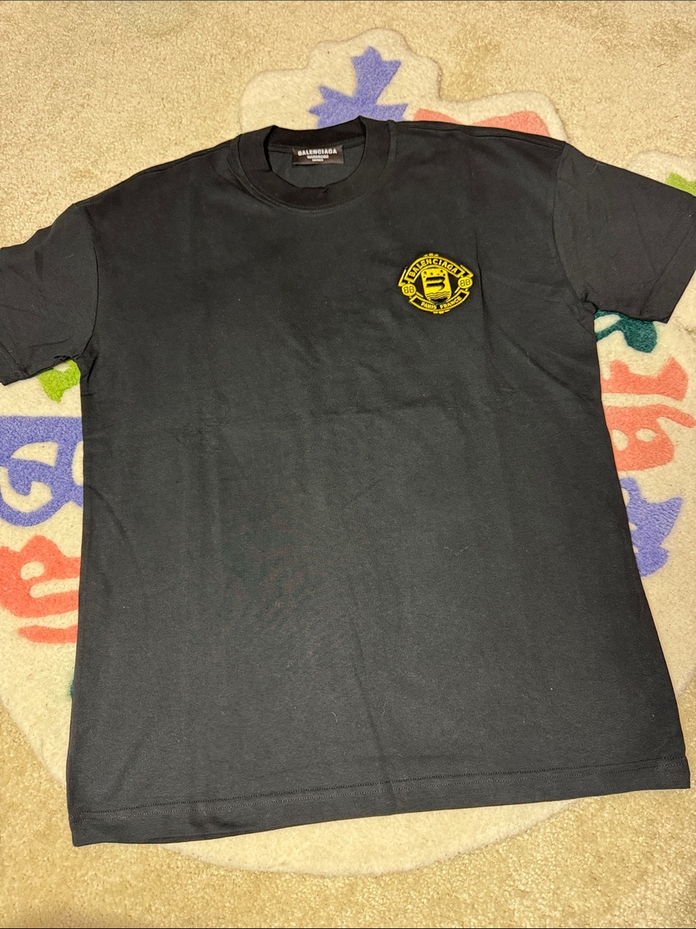 Balenciaga Black Short-Sleeve Tee with Yellow Chest Emblem